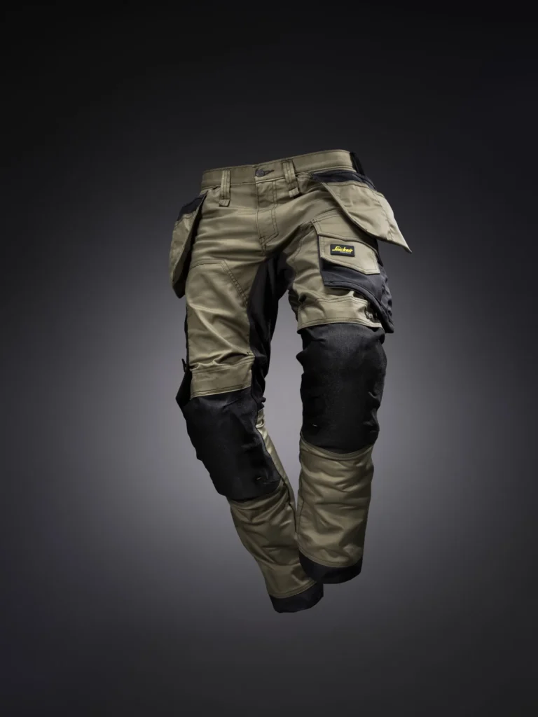 Wytrzymałe spodnie robocze z kieszeniami monterskimi i wzmocnieniami na kolanach na ciemnym tle